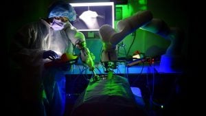 A photo of the STAR system operating over a table with a person standing next to it